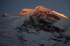 20 First Rays Of Sunrise On Shishapangma Main And East Summits And East Face From Kong Tso The first rays of sunrise silhouette the Shishapangma main summit (8012m) and the central summit on the right with the steep east face from Kong Tso camp (5198m).